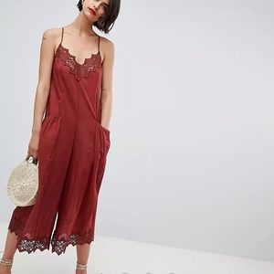 ASOS DESIGN jumpsuit with lace trims and oversized pocket detail